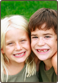 stock photo young brother and sister with missing teeth